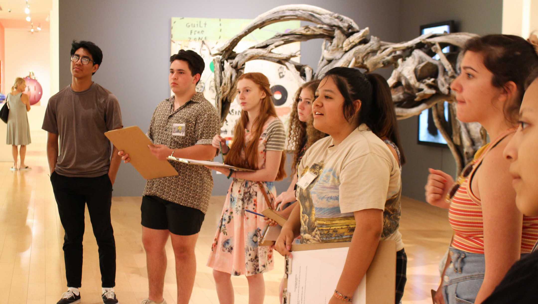 teens learning about art in a gallery