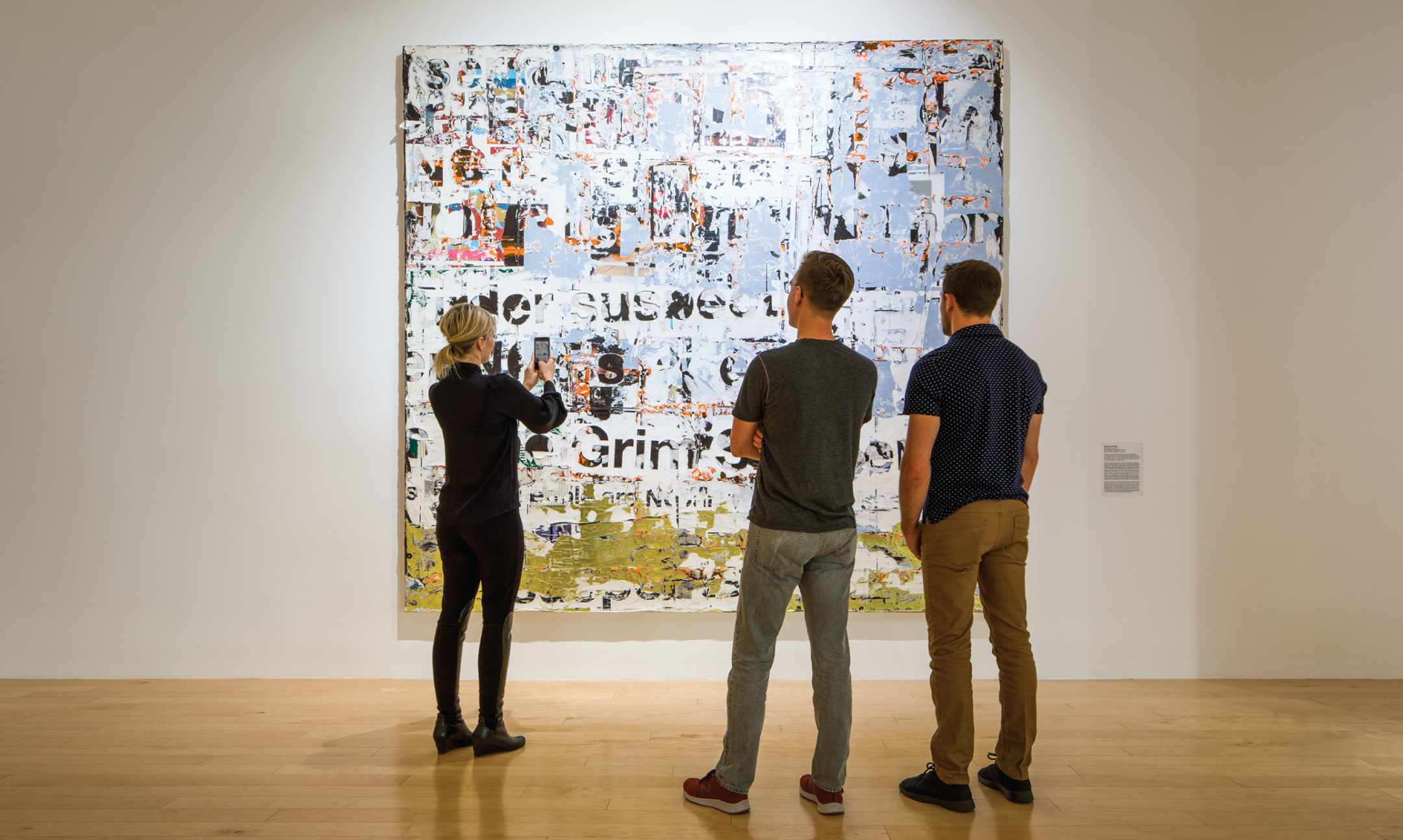 People watching Art in a gallery at Palm Springs Art Museum